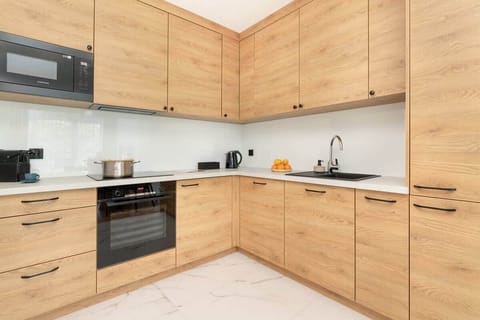 The fully equipped kitchenette includes everything you need for a home-cooked meal.