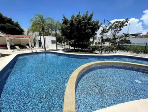 Sunny, clean and clear swimming pool in the common area, ready to enjoy!