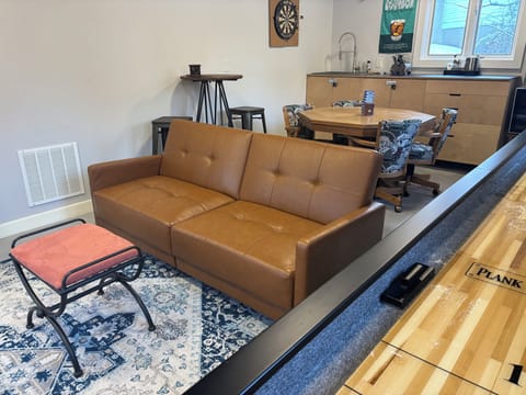 1st level: Brown Futon folds down- bed measures 44" wide by 70" long.