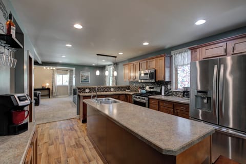 Huge open kitchen and view into the living room.