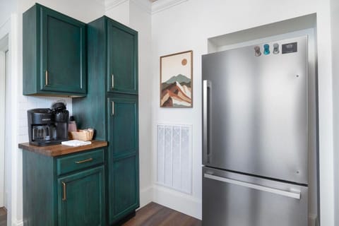 Prepare meals with ease in this thoughtfully stocked kitchen with modern amenities.