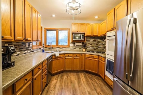 Main kitchen stocked with pots, pans, dishes, utensils, glasses, and lots more