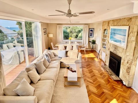 Living Room - 1st floor, with 8 seater couch, large TV, 8 seater dining table.