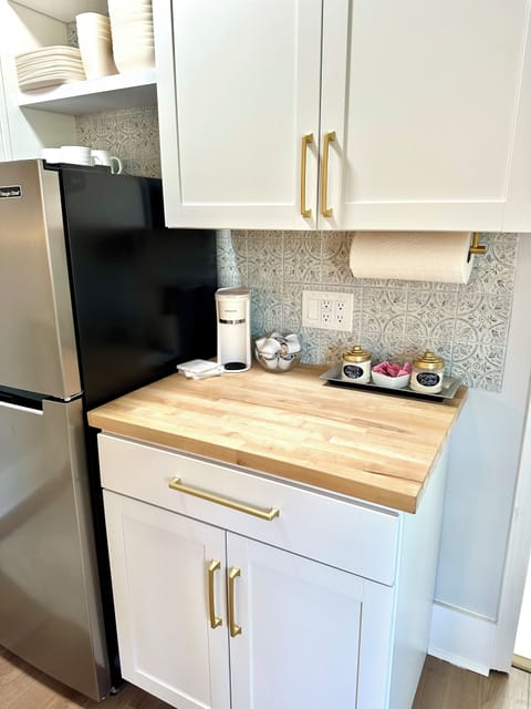 Coffee station with a variety of K cups, creamers, & sugar!