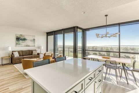 Gather around the island for meal prep, laughs, and views—it's the hub of the open living space, designed for connection and comfort.
