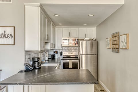 Enjoy cooking in this spacious kitchen. Featuring stainless steel appliances, a coffee maker, and all the essentials to make your favorite meals.