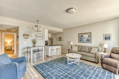 Kick back and relax in this spacious living area with cozy seating and a breakfast bar. Perfect for lounging, chatting, and enjoying downtime.