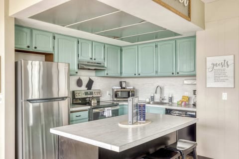 Functional kitchen providing essential appliances creating a clean and practical cooking space