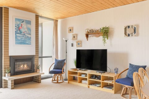 Relax by the cozy fireplace in this inviting living space. Perfect for unwinding after a day of adventures!