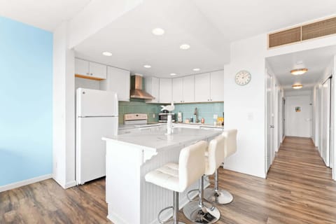 Whip up delicious meals in this modern kitchen, then gather around the island! Perfect for easy entertaining. 