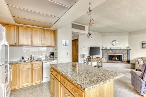 The island provides ample space to prep while also providing seating for company. Open floor plan means no one is missing out on the festivities!