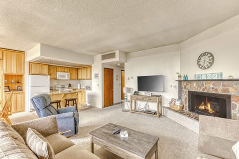 A modern, open-concept living space with large windows, cozy seating, a spacious dining area, and a bright, inviting atmosphere.