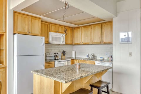 Functional kitchen providing essential appliances creating a clean and practical cooking space.