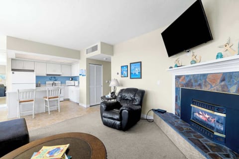 Your ideal gathering spot! Seamless flow from kitchen to living with fireplace & entertainment.