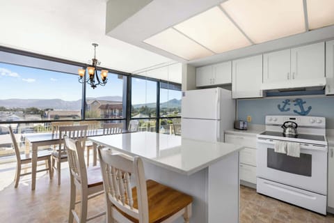 Functional kitchen providing essential appliances creating a clean and practical cooking space.
