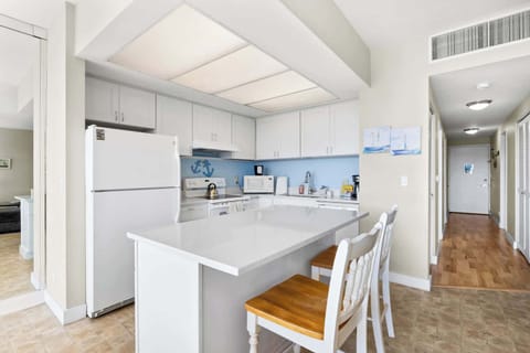 Functional kitchen providing essential appliances creating a clean and practical cooking space.