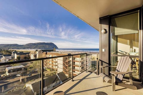 Private balcony with panoramic beach views—perfect for sunsets, morning coffee, and relaxing coastal stays.