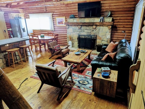 Living room with TV and fireplace