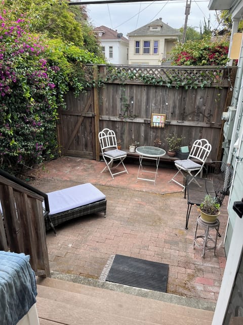 Back yard has been updated with new couch and additional seating not pictured