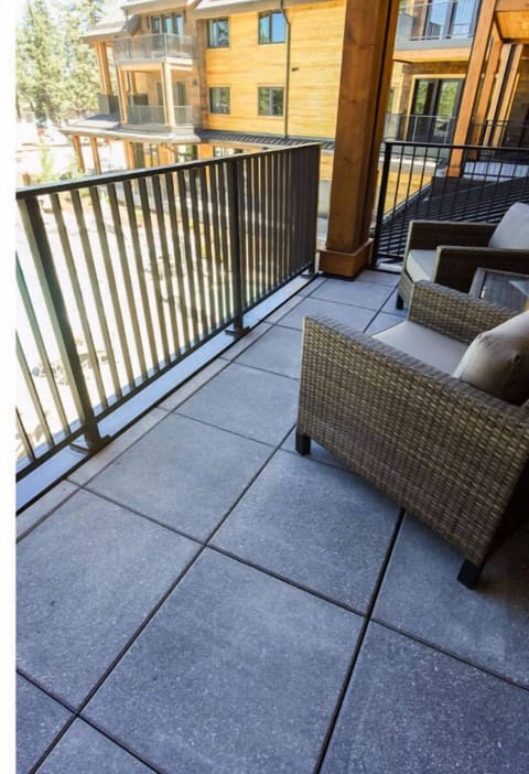 Enjoy fresh air and outdoor relaxation on this private balcony, furnished with comfortable seating and overlooking beautiful surroundings.