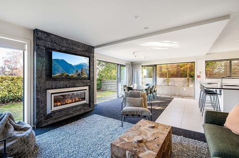 Modern Comfort with Scenic Views
This spacious living room blends modern design with cozy comfort, providing the ideal spot to take in the mountain views. A perfect blend of style and serenity.