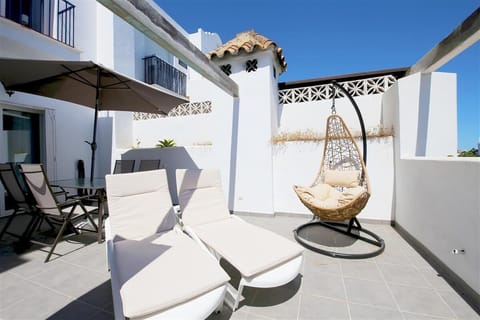 Large and sunny private terrace with outdoor dining area and sunloungers