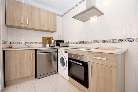 Kitchen in this apartment is fully fitted with quality appliances