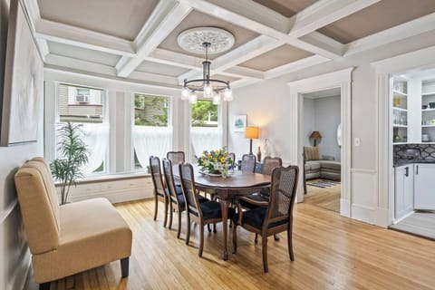 Spacious dining room with classic design and modern lighting ️ Create lasting memories around the table in this lovely home.