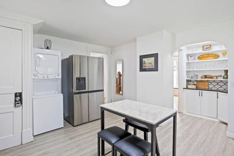 Inviting kitchen with cozy dining nook and well-stocked shelves ️☕ Enjoy a home-cooked meal in this lovely space.