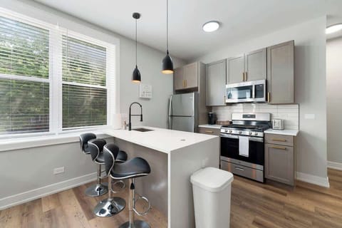 Bright kitchen view showcasing clean lines & airy workspace.