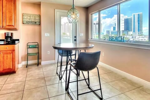 Intimate breakfast nook by the window, a cozy spot for morning coffee or evening drinks.