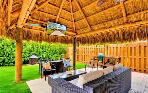 When relaxation meets entertainment in our charming tropical tiki porch.