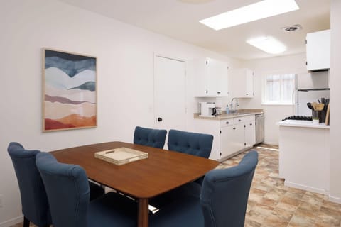 Cozy dining area with 5-seater table next to the kitchen