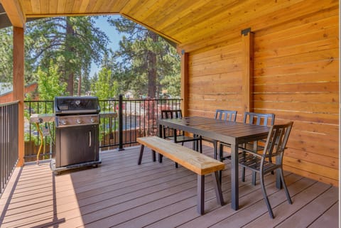 - Enjoy outdoor dining with a BBQ grill - perfect for group meals  
- Covered deck with modern patio furniture - cozy mountain experience  
- Relax with fresh pine air while grilling - Tahoe vacation rental charm