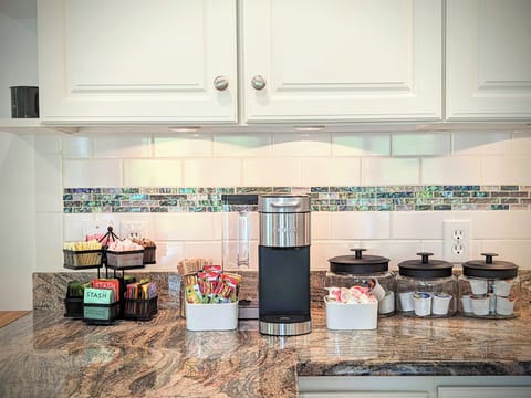 The kitchen coffee station with assorted coffees, teas, & snacks.