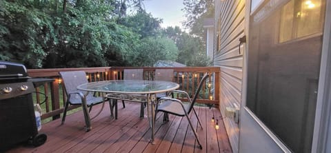Deck with outdoor furniture and a grill