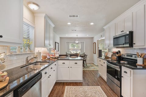 A fully stocked kitchen with modern stainless-steel appliances, ready for any culinary adventure.