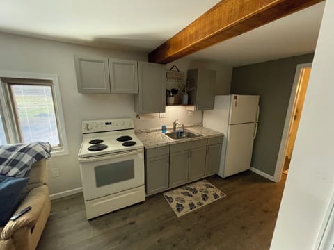 Well equipped kitchen with range, full size refrigerator