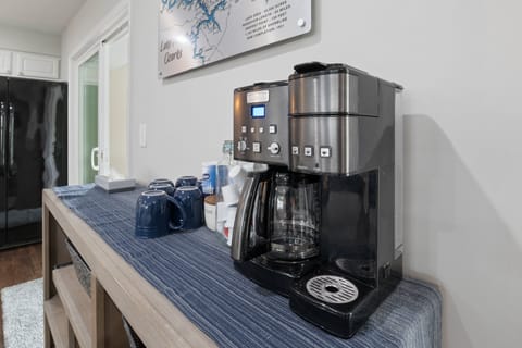 Coffee station with a modern coffee maker and all the essentials for a perfect morning brew.