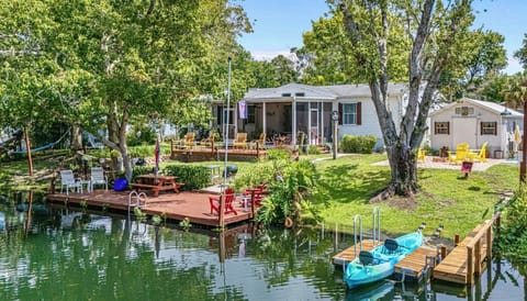Dock with ladder, kayak launch, picnic table, yoga dec, fire pit, movie theater 