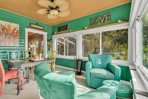 Unwind in the charming set of emerald blue chairs - an ideal spot to relax and enjoy the serene surroundings!