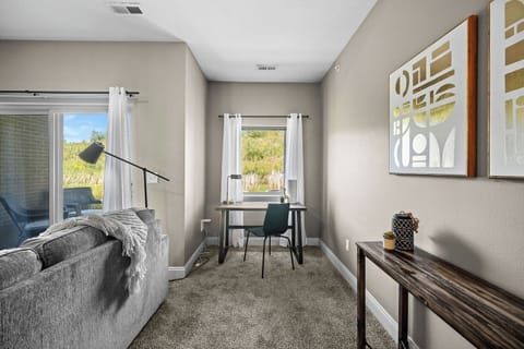 There is a desk and chair for studying, working, etc.