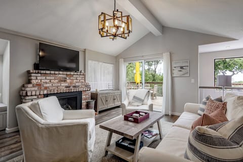 Living room with cozy brick fireplace