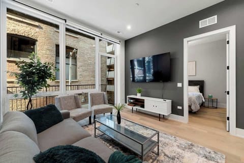 Inviting living room w/ comfy sofa & natural light.