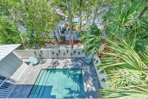 A secluded oasis surrounded by greenery and tranquil design.