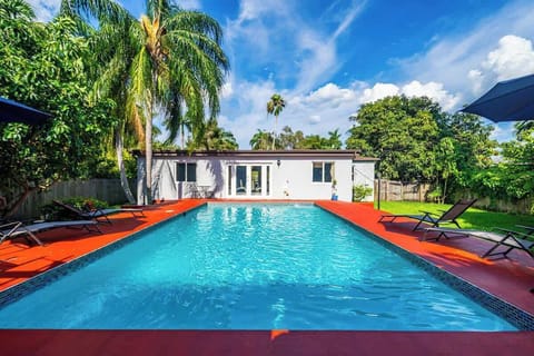 Tropical poolside paradise—perfect for vacation rentals and short-term stays. Enjoy sunny vibes, shaded loungers, and lush landscaping ideal for family fun, romantic escapes, or group getaways.