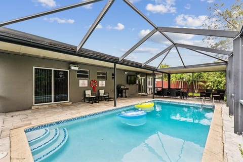 Dive into relaxation with a refreshing swim in this private, screened-in pool, perfect for unwinding or enjoying sunny days with friends and family.
