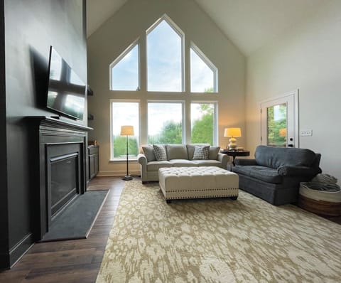 Living room with treetop long range views