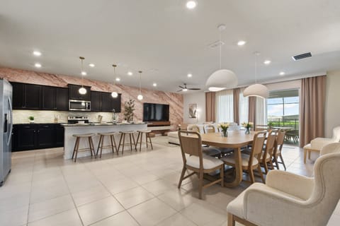Spacious open-concept living, dining, and kitchen area with elegant modern touches!