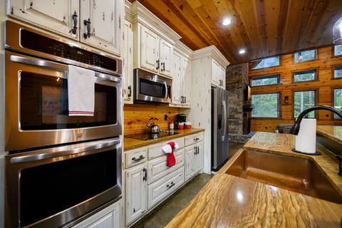 Whip up delicious meals and warm treats with ease—our cabin’s kitchen oven is your culinary companion.